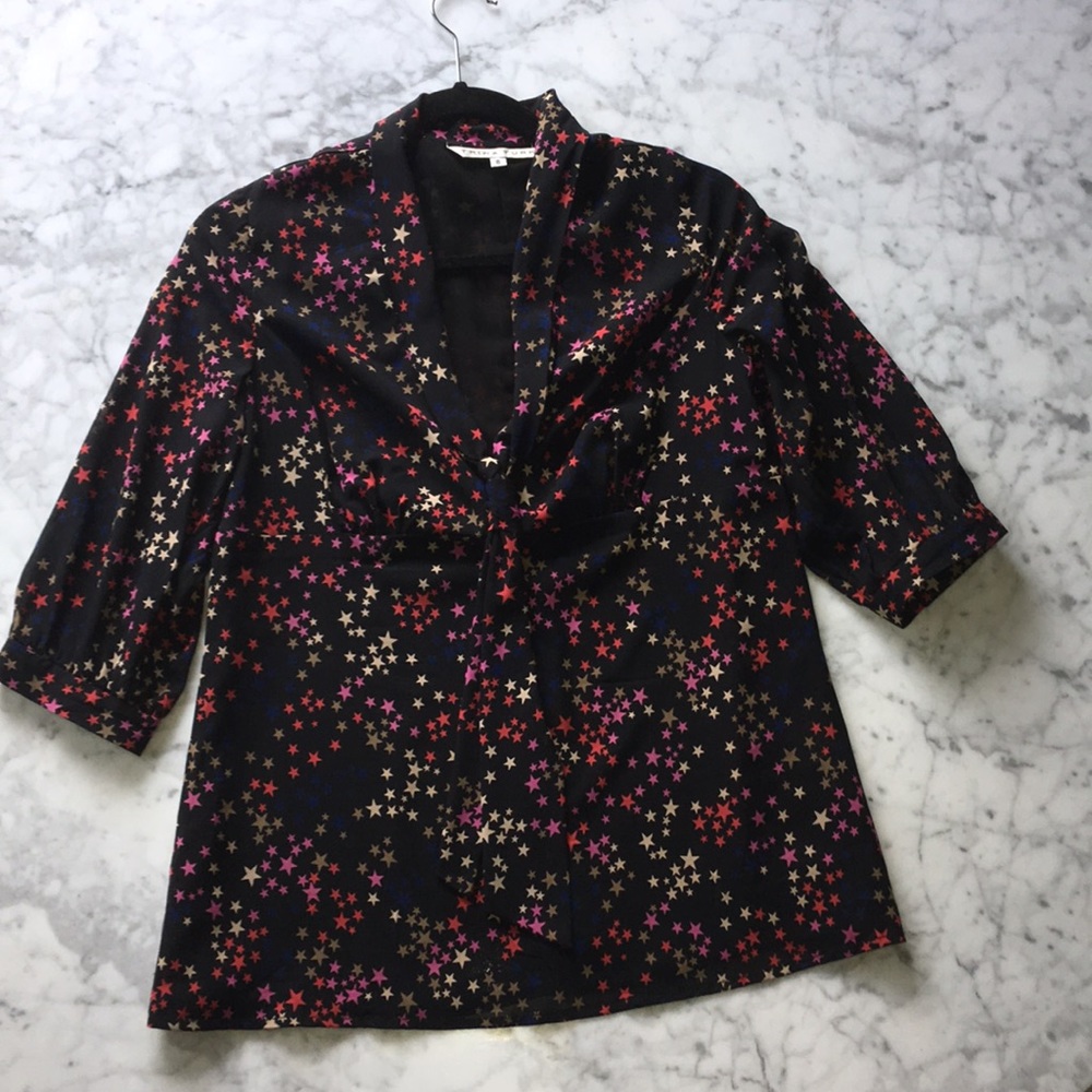Cute Trina Turk starry blouse with tie